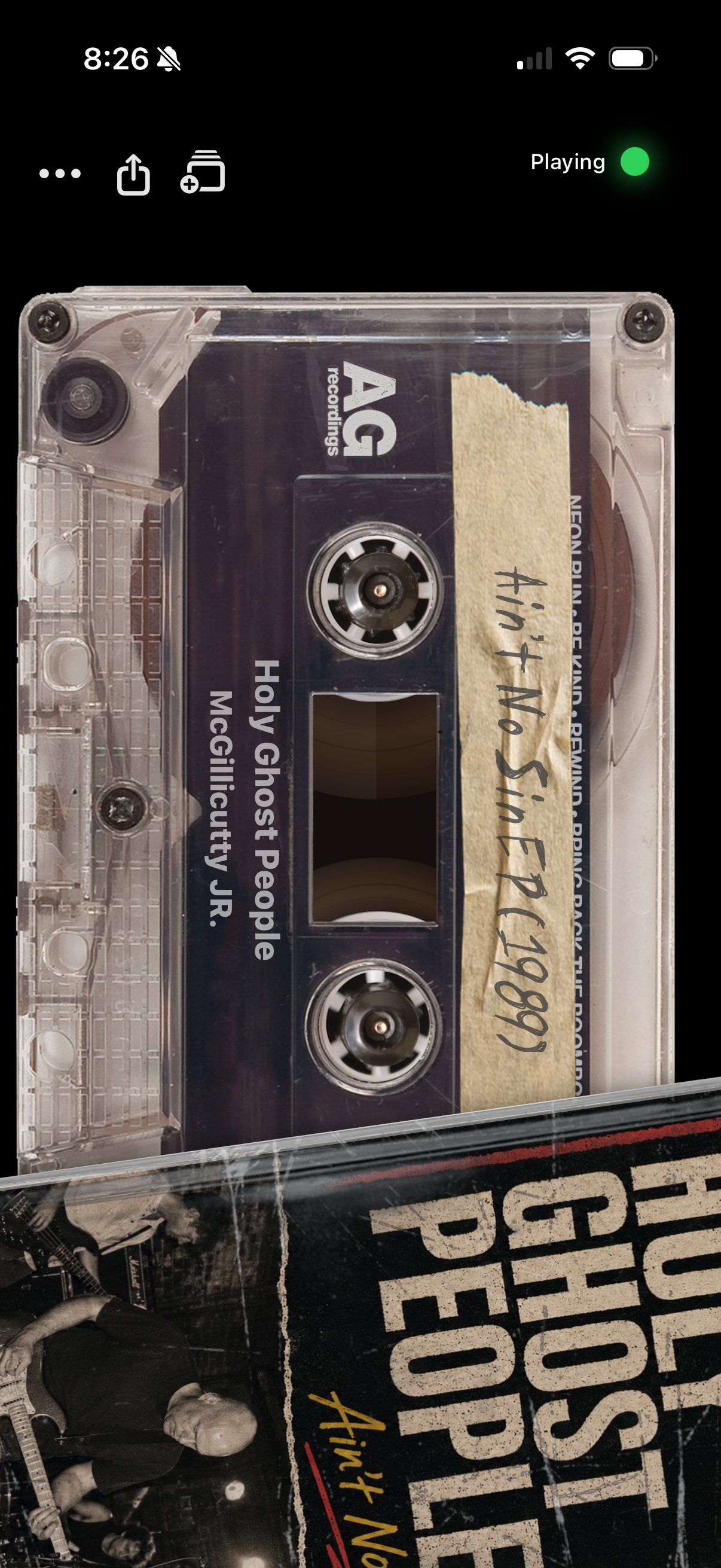 Side A now-playing screen showing a cassette with spinning reels